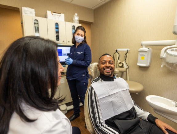 The smiling Port Chester dentists and team members at Westchester Gentle Dentistry smiling